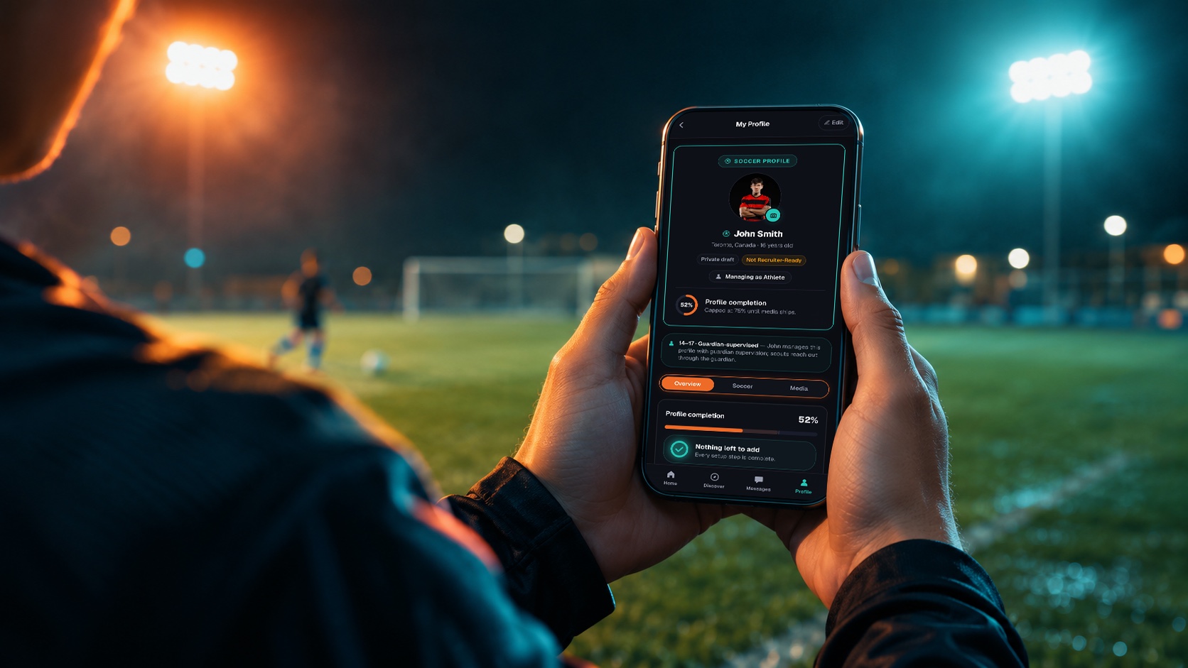 An athlete holding a phone showing their UnicAthlete soccer profile